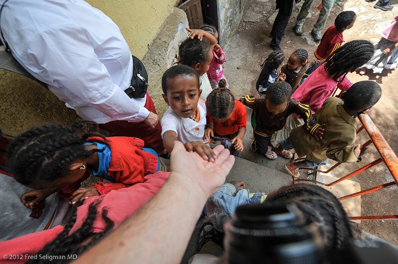 20120328_113630 Nikon D3 2x3.jpg - The children are reaching out to my outstrecthed hand.  I came to Ethiopia at the invitation of Dr. Fish.  We grew up together in Montreal.  I did not know what to expect but came away completely captivated by the amazing endeavor my friend has created and nurtured and with minimal funding.